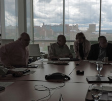 A photo of industry leaders collaborating about accelerating the commercialization of environmental and energy innovations for a sustainable future.