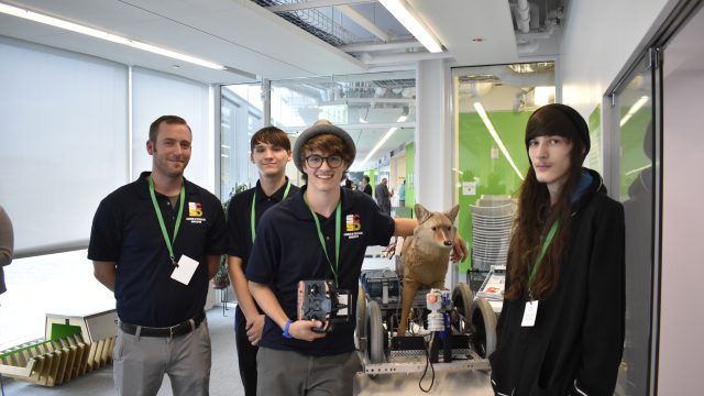Students and teacher with robotic coyote